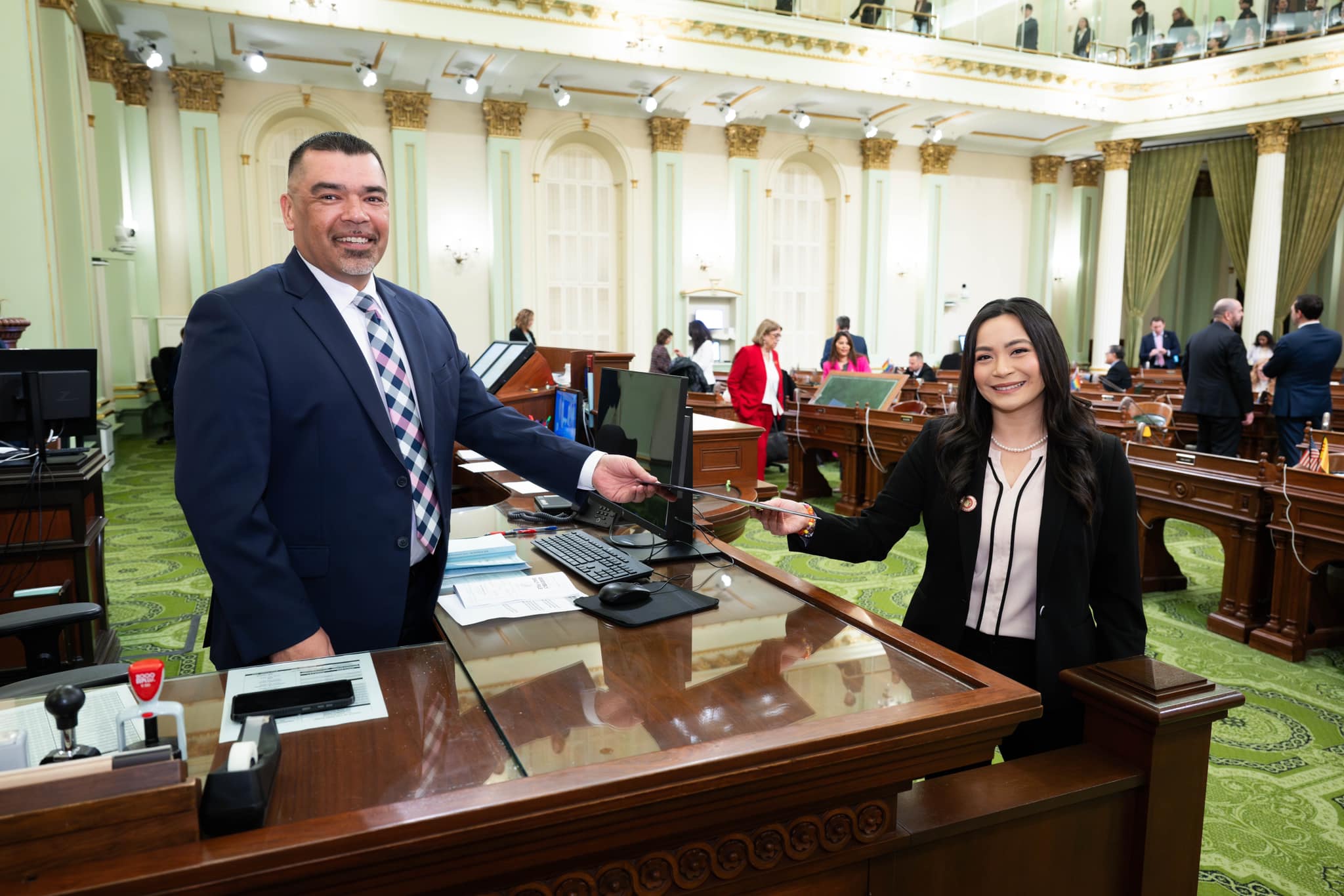 Caloza present a bill at the Assembly Desk.