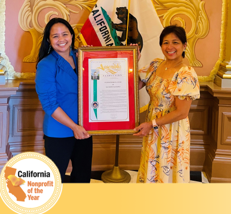 Executive Director Aquilina Soriano Verzosa (left) presented with the 2022 California Non-Profit of the Year Assembly Resolution.
